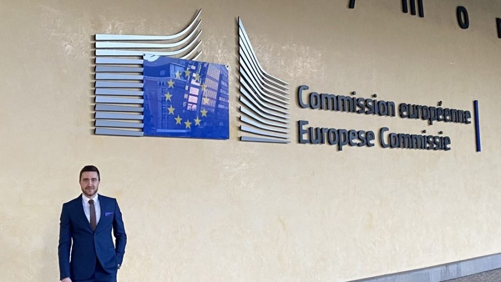 Person standing in front of the European Commission