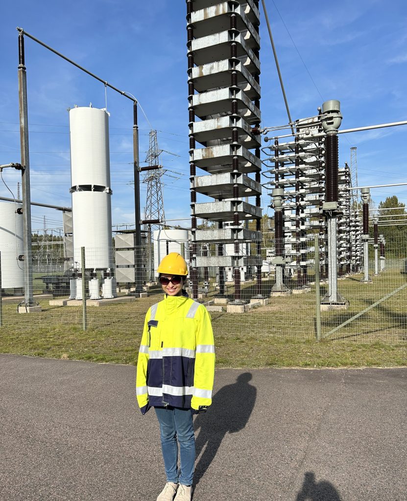 Woman standing in front of converter station